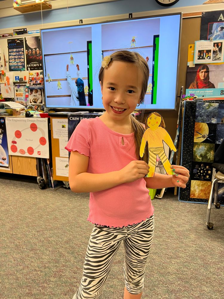 The friction climber character matches what the student is wearing
