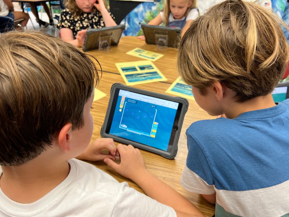 Students work together to solve the challenge 
