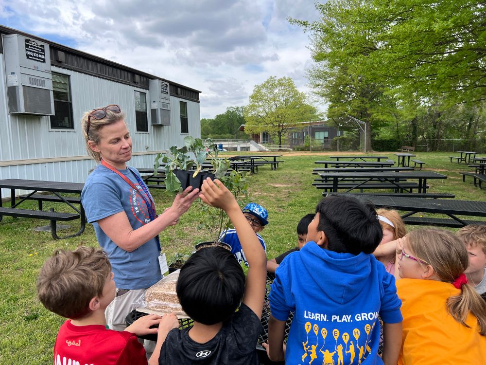 Science Coach Carrie Lombardi talks about plants parts with students 