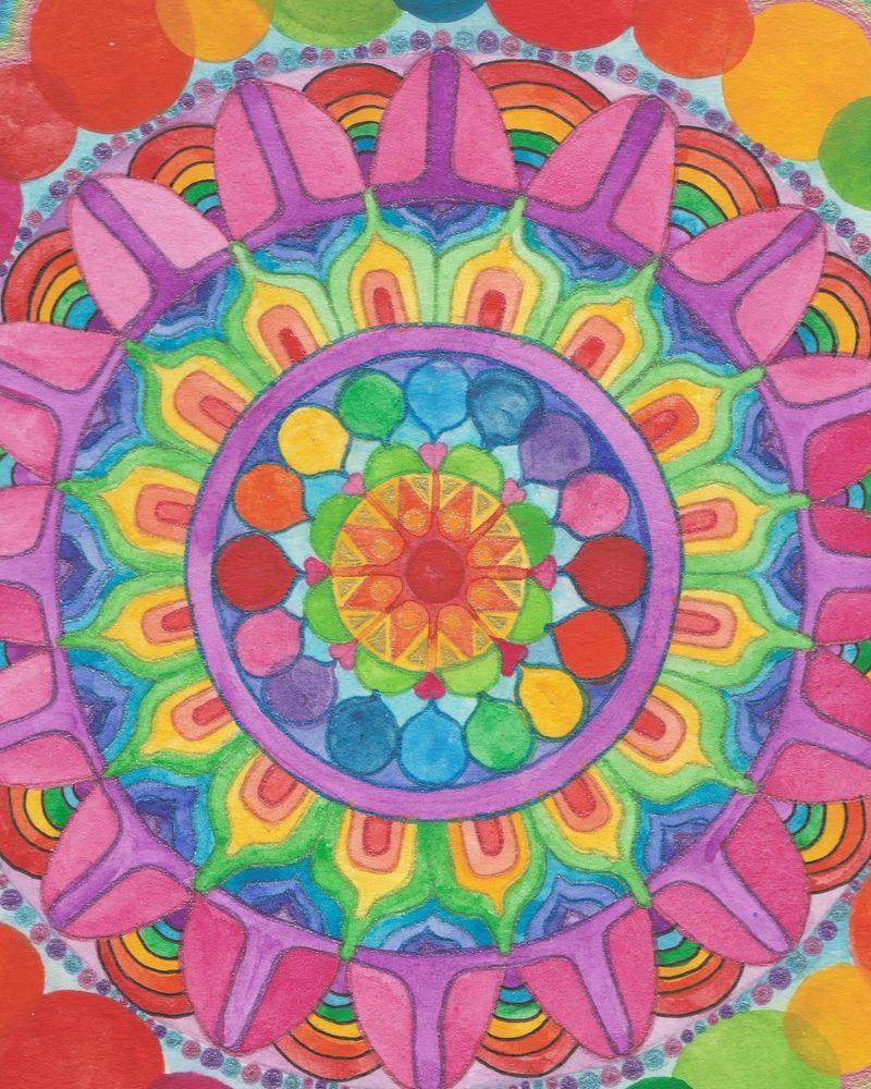 A colorful watercolor mandala that I painted in a sketchbook. 