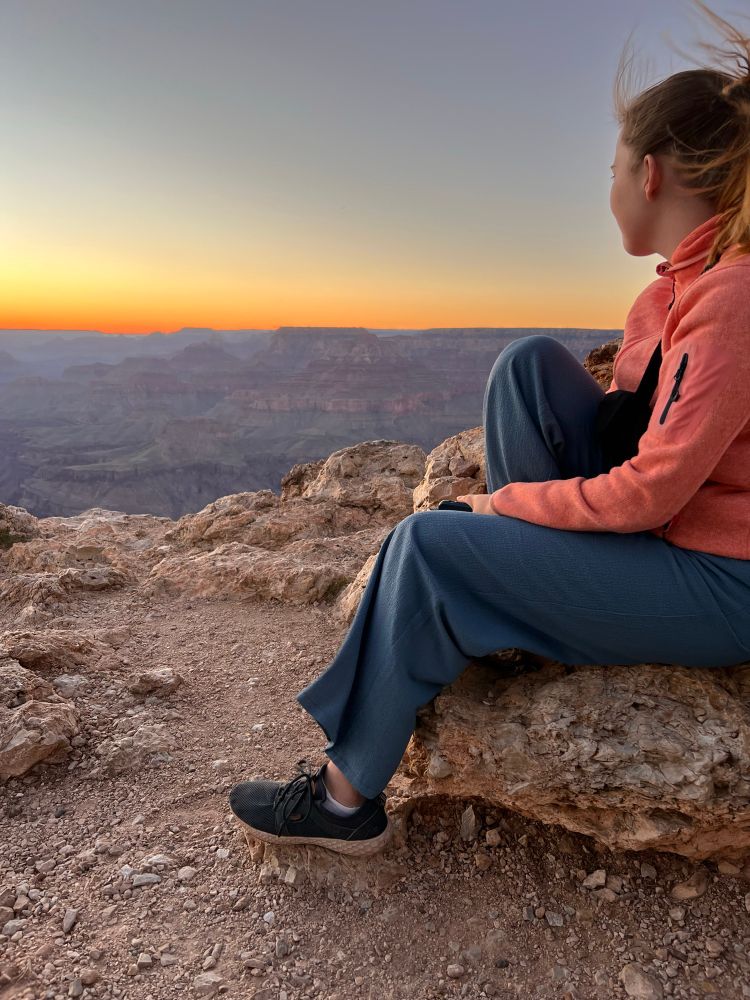 Kristy Sweetland’s niece sits on the edge of the Grand Canyon watching a sunset. 
