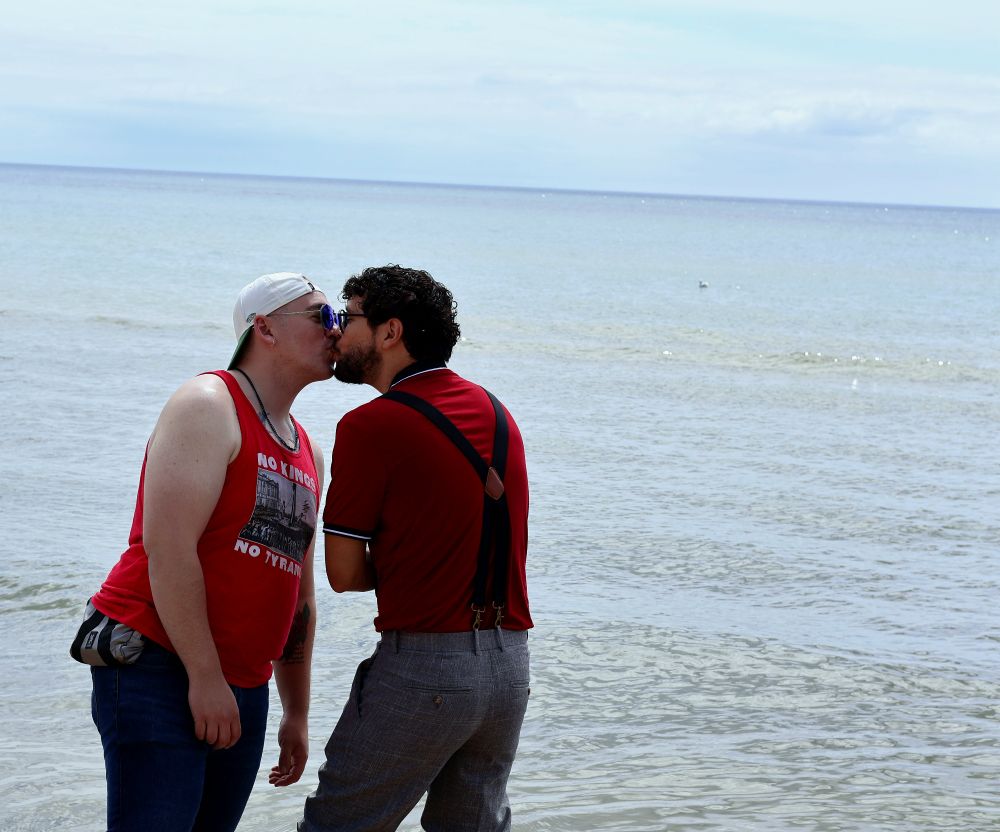 Alec and I kissing with Lake Michigan behind us.