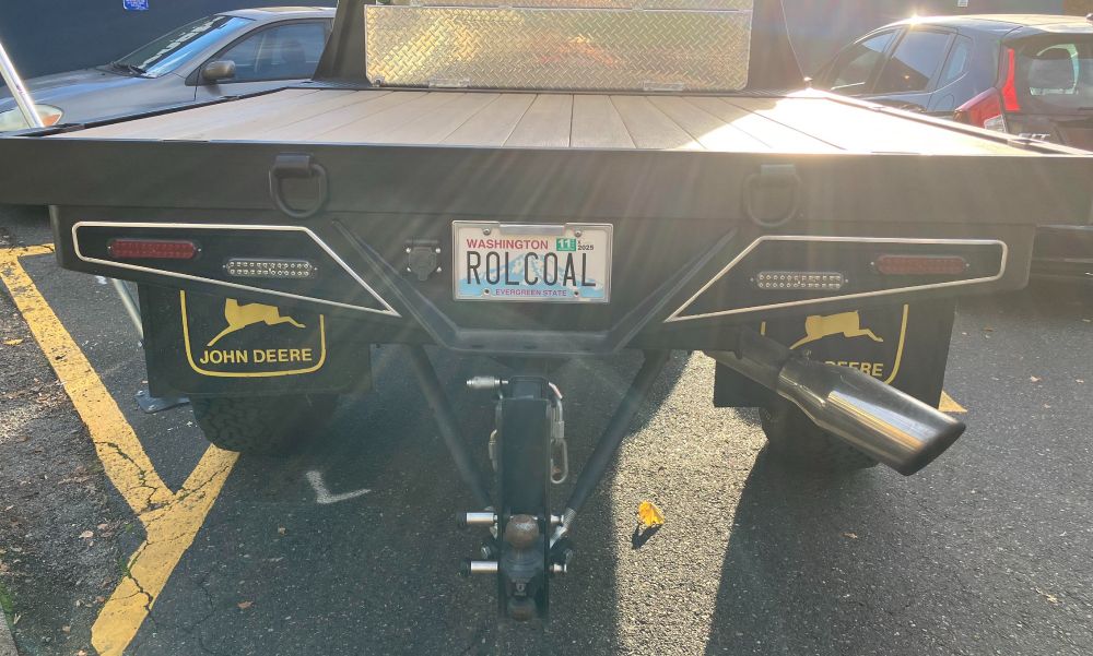 photo of rear of pickup truck with vanity license plate that reads, "ROLCOAL"
