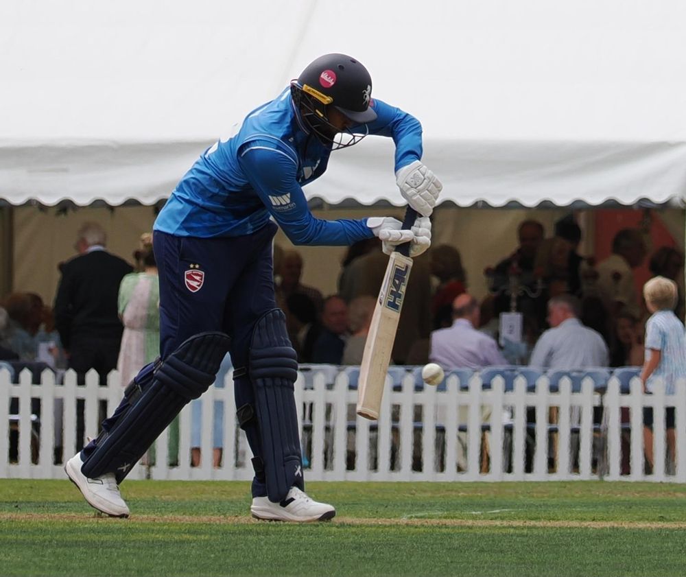 Cricket battery about to hit the ball.