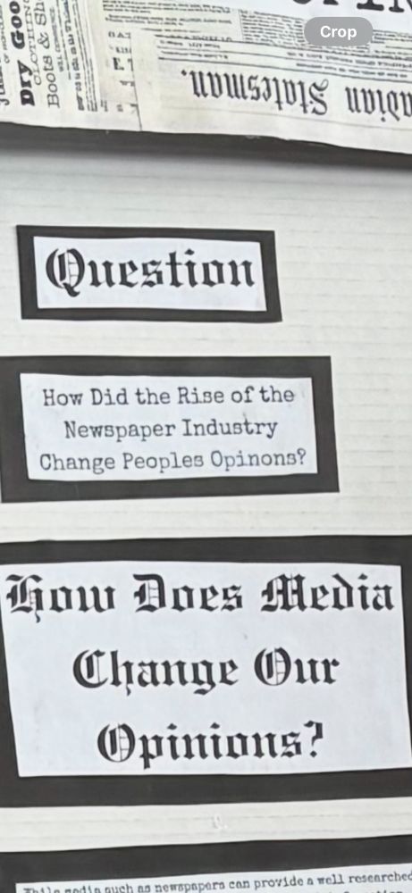Closeup of project board. Black and white. Word ‘question’ at the top. “How did the rise of the newspaper industry change people’s opinion?” underneath. “How does media change opinions?” underneath that. 