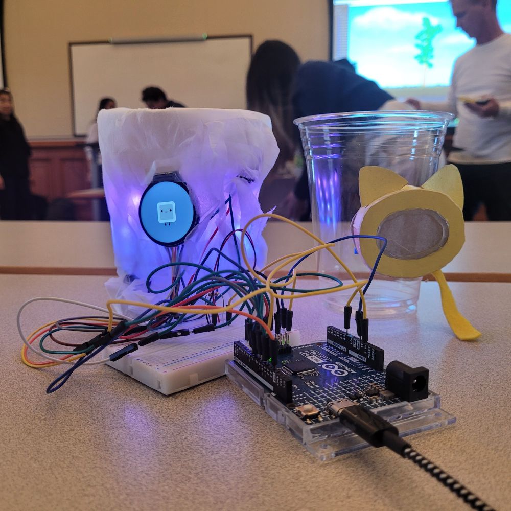 The digital Party Pet next to the "looks like" cardboard prototype.