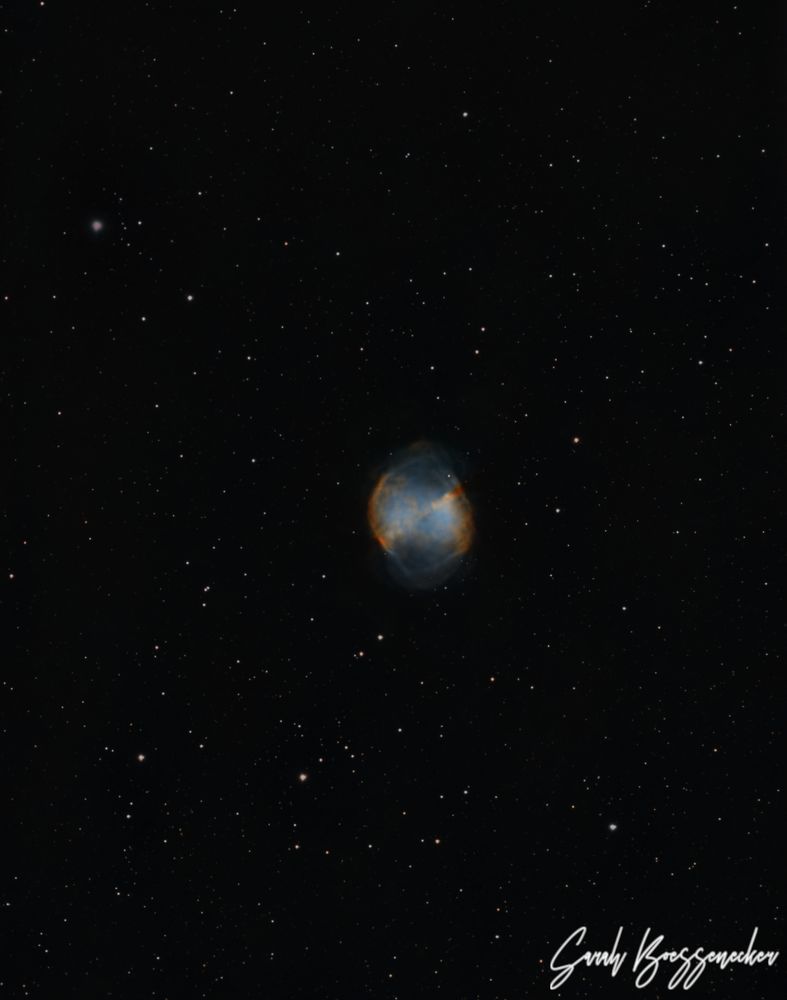 a small nebula resembling an apple core in a field of stars