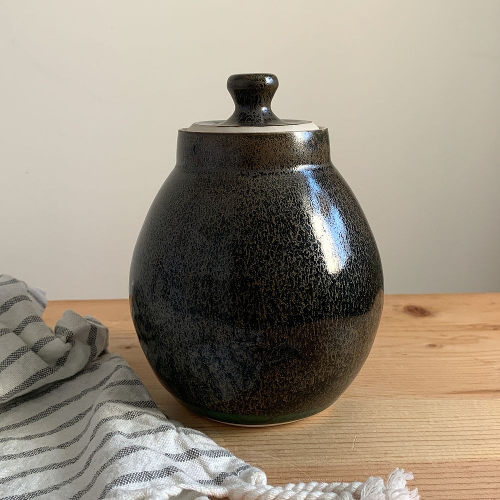 Small lidded jar, with kind of an oil spot effect.