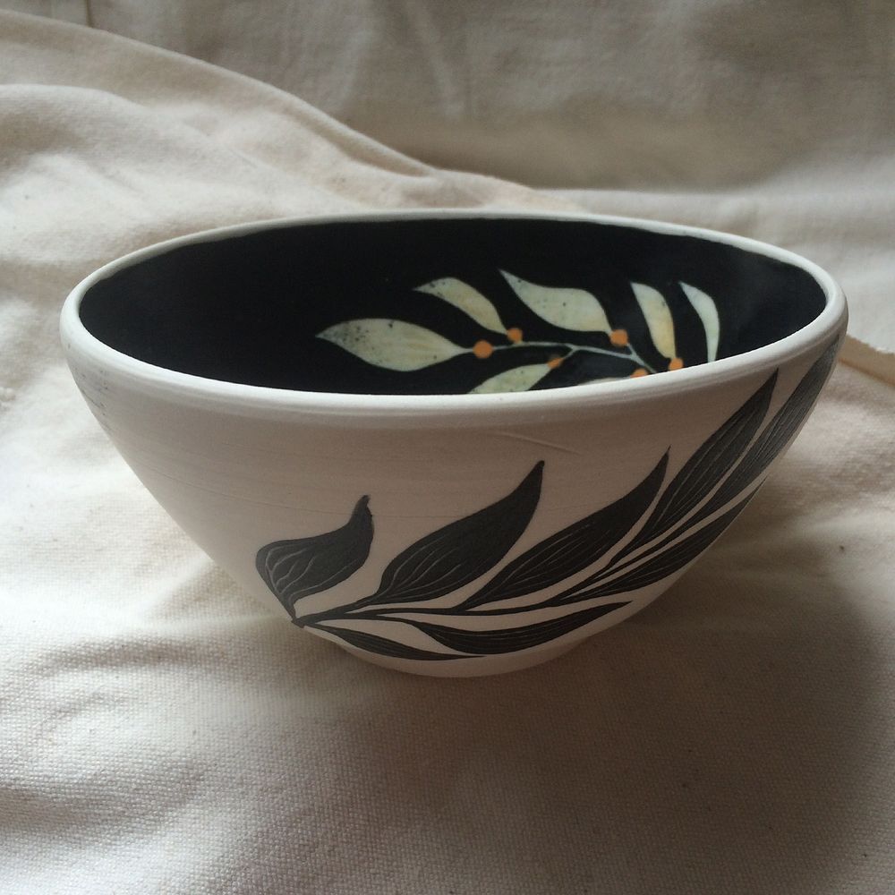Bowl with a whale and algea, painted with underglazes on white clay