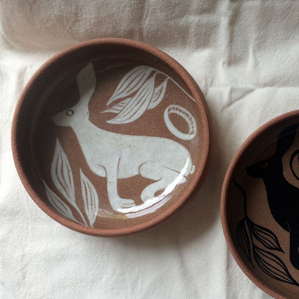 White hare on terracotta clay