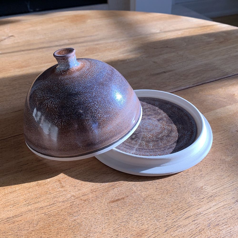 One wheel thrown butter dish, with a galaxy looking glaze (purples, blues and sienna hues and dots).