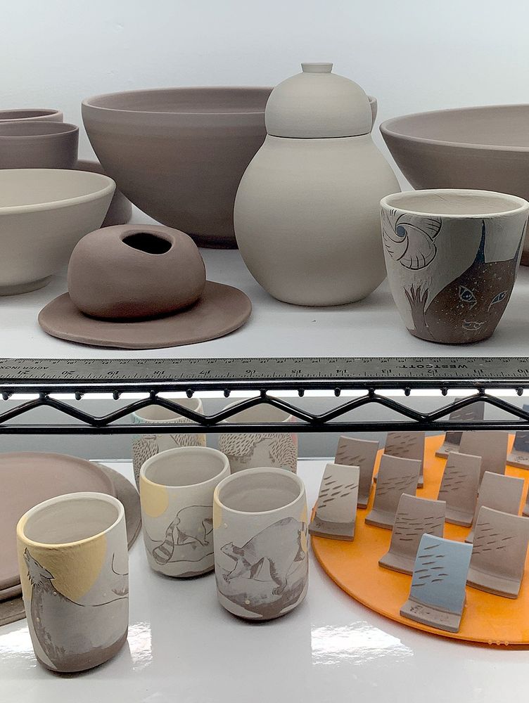 Multiple clay forms on shelves (bowls, tumblers, jars, strange things), made with lots of love and patience.