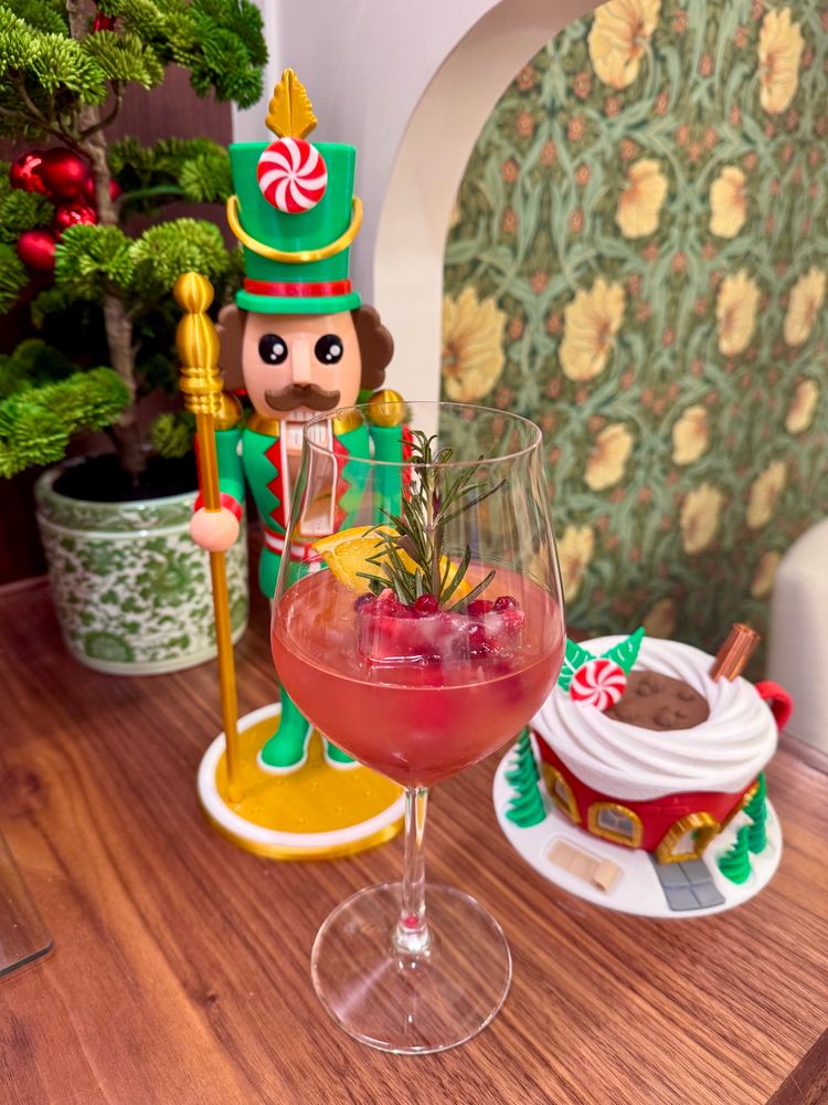 Cosmo mocktail with fancy cranberry pomegranate ice cube.