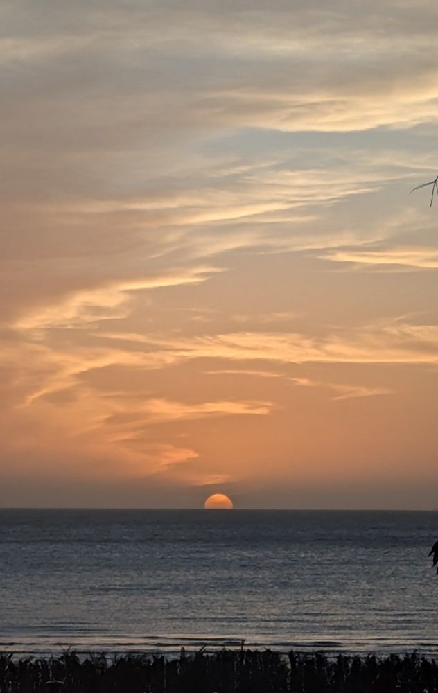 sun setting on the sea of Playa Ramirez, Montevideo, Uruguay 