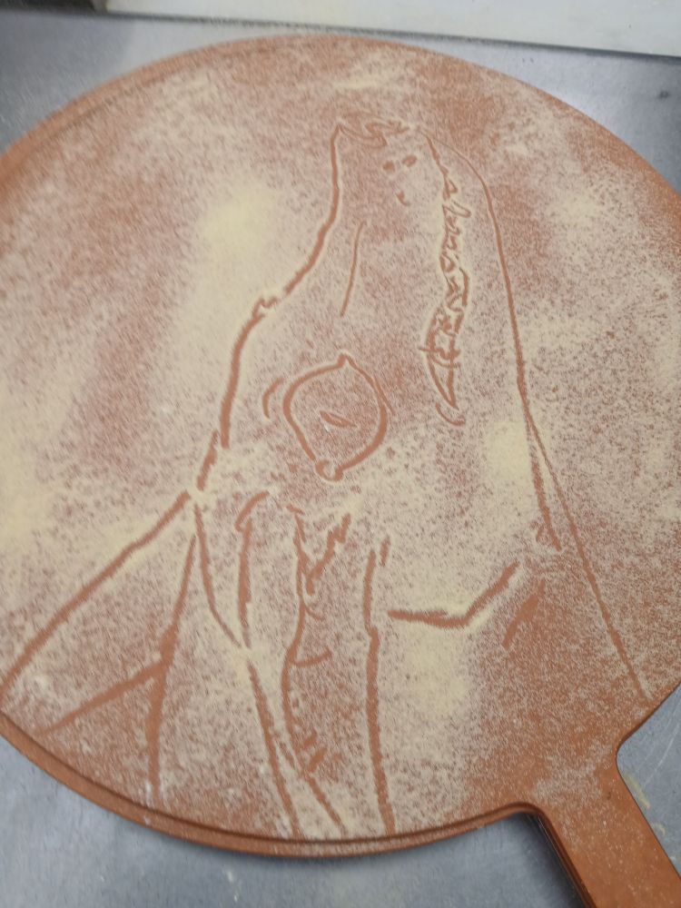 Pizza semolina drawing of a dog head