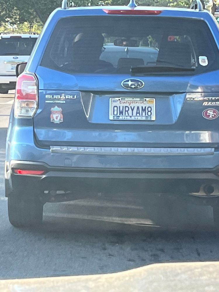 a subaru license plate that reads OWRYAM8