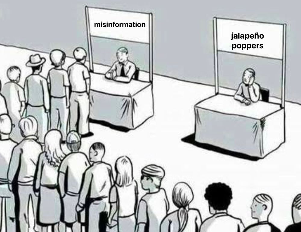 a long line in front of a booth labeled misinformation with another booth labeled jalepeno poppers and no line