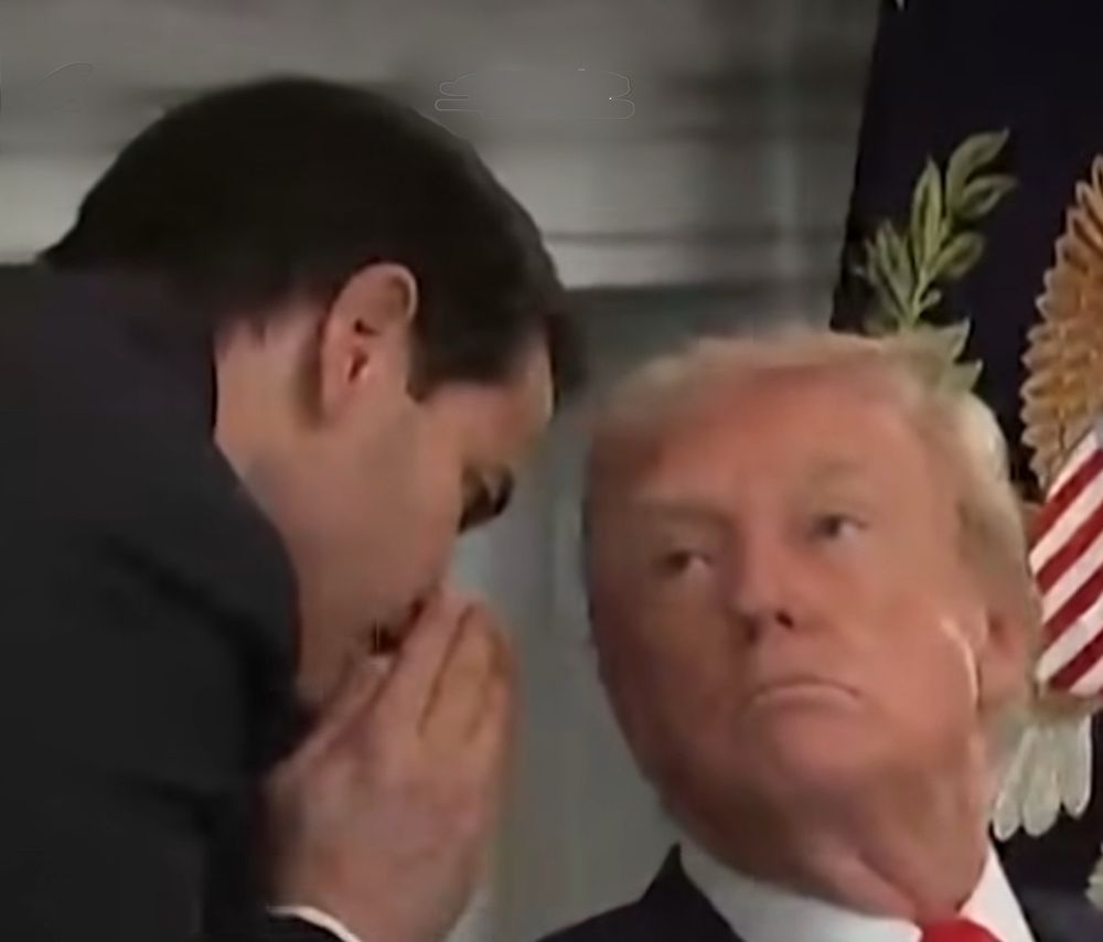 Marco Rubio whispering into the ear of Donald Trump, very akin to the photo of George W Bush receiving word of 9/11