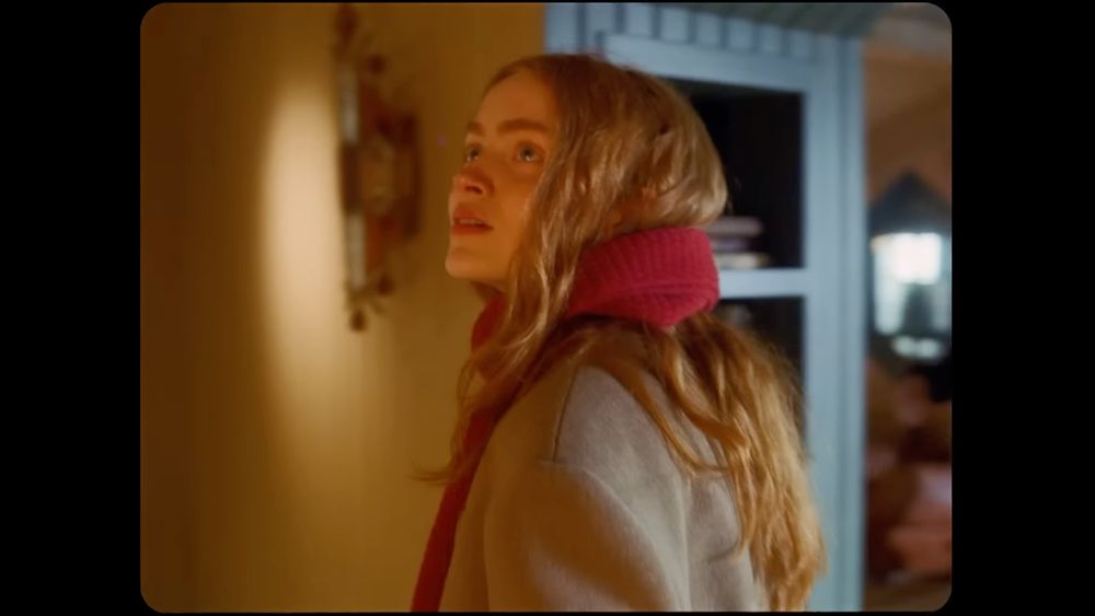 sadie sink in the all too well short film with red hair wearing a red scarf