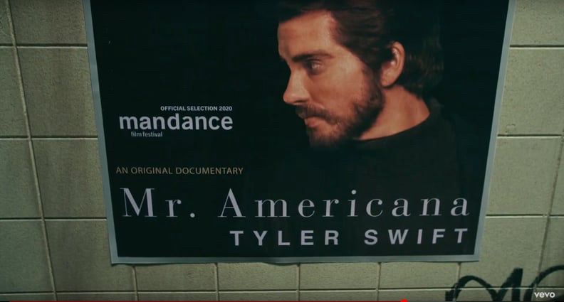 a poster on the wall of a subway station for an official selection at the 2020 mandance film festival - tyler swift in mr. americana, an original documentary