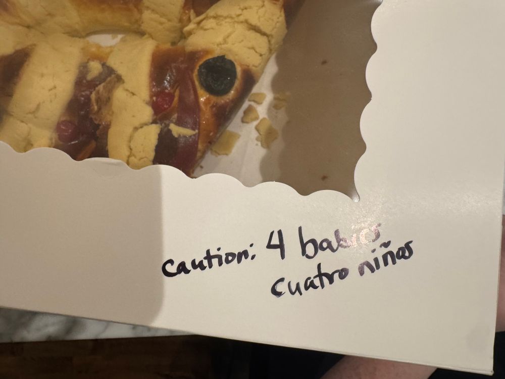 Box says "Caution: 4 babies, cuatro niños"
