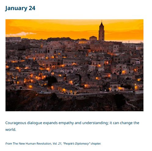 Photo of a city at dusk with a red/orange hue. Text: Courageous dialogue expands empathy and understanding; it can change the world - From The New Human Revolution Vol. 21 "People's Diplomacy" chapter

