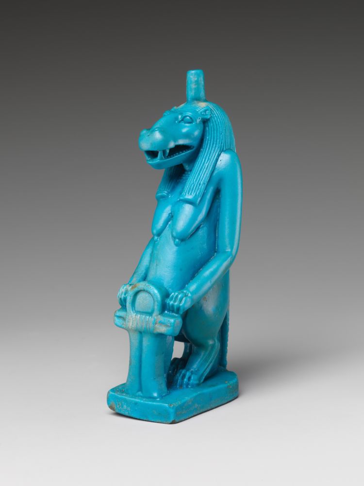 Pictures from the MET-database, showing a blue statue of the standing hippo goddess with her front paws resting on a sa-sign