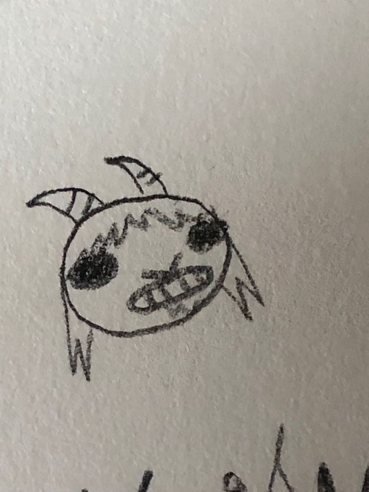 A headshot of a Parlsona with black beady eyes looking like a goat. It is cringing at something.