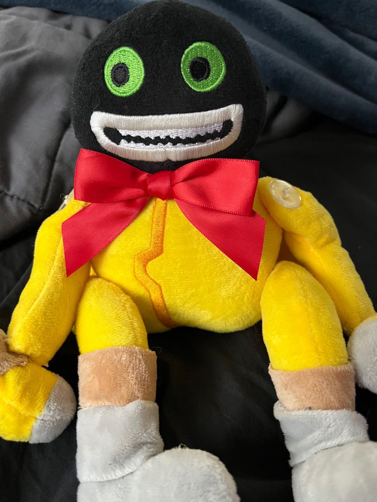 Terrible bootleg of an eaw (whose new name is James) with a big red bowtie around their neck