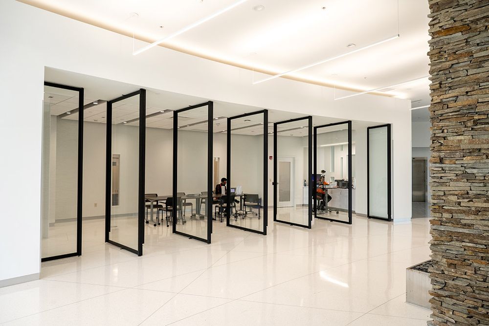 Interior of a building with white walls and glass dividers
