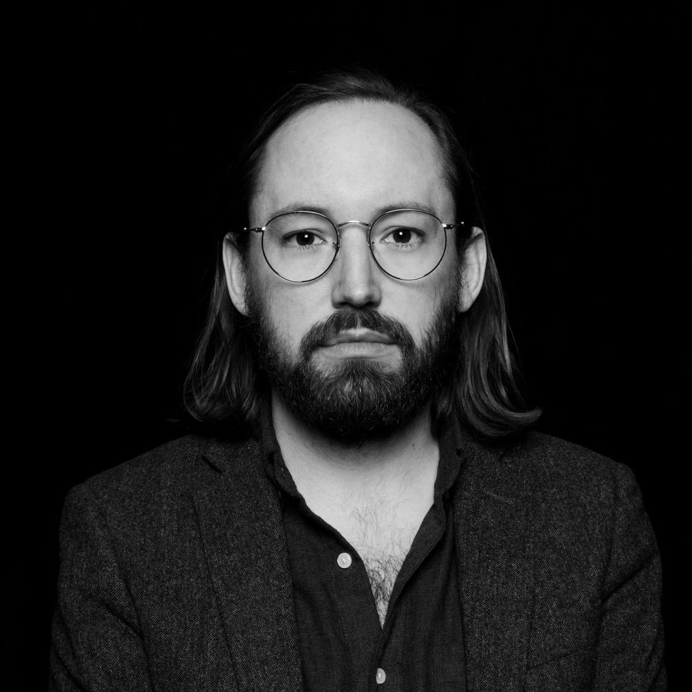 His avatar, B&W photo of a man with a blank, vacant stare. Big 