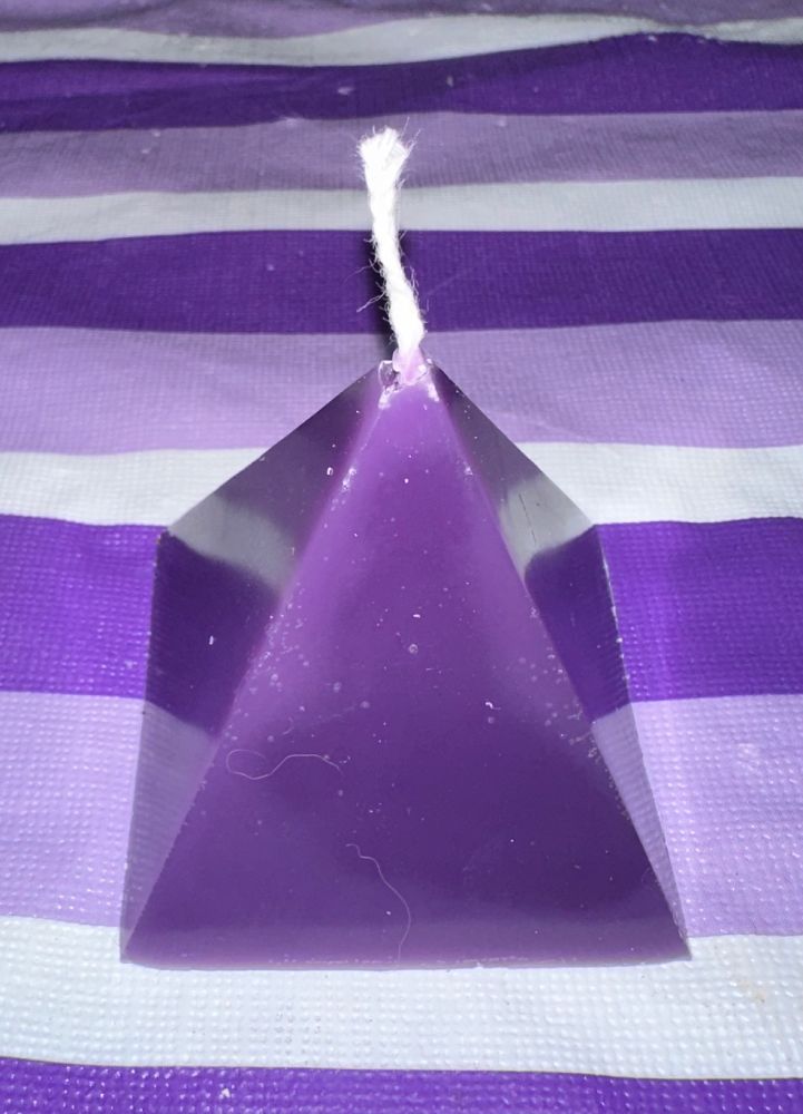This is my standard Pyramid Candle. With your normal four sides, this purple pillar candle is about 3.5 inches tall. This is a side view that highlights the sides. I was displeased with the top, as it seemed to fracture when removed from the mould. So this is the only one I ever made. 