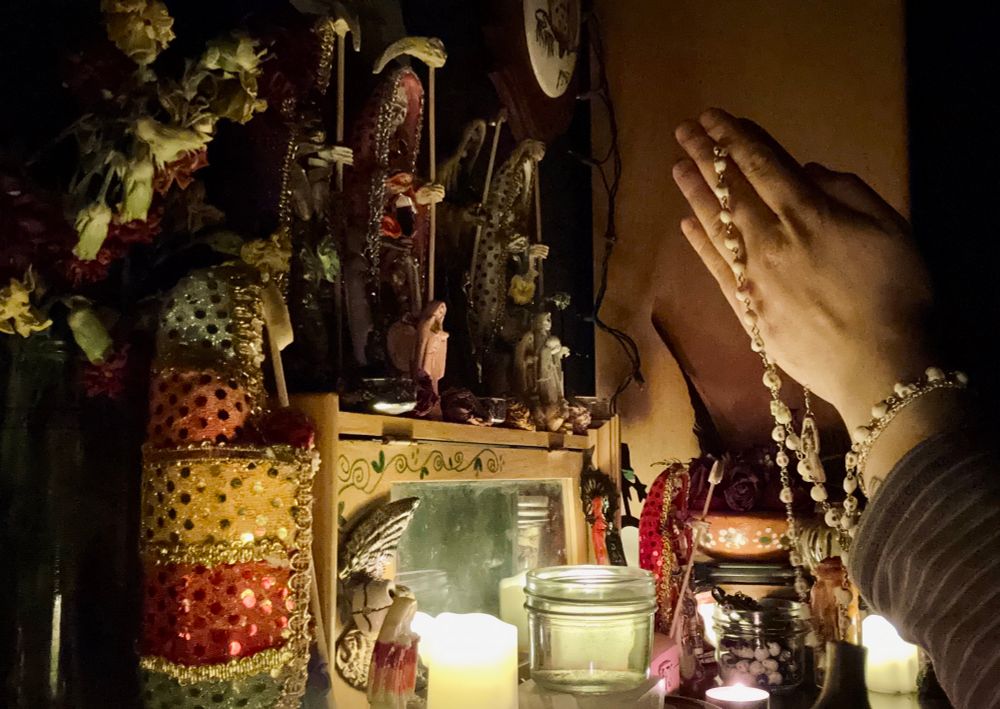 me praying with a rosary at the altar