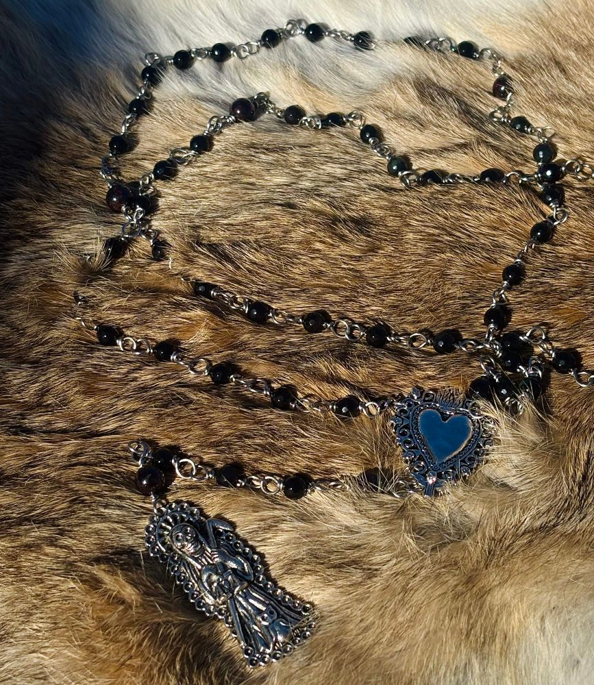 obsidian and garnet rosary with a silver sacred heart and santisima charm 