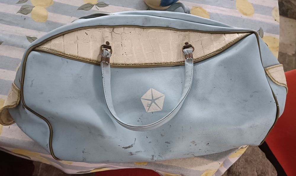 Vintage powder blue and cream handbag featuring the Chrysler Pentastar logo