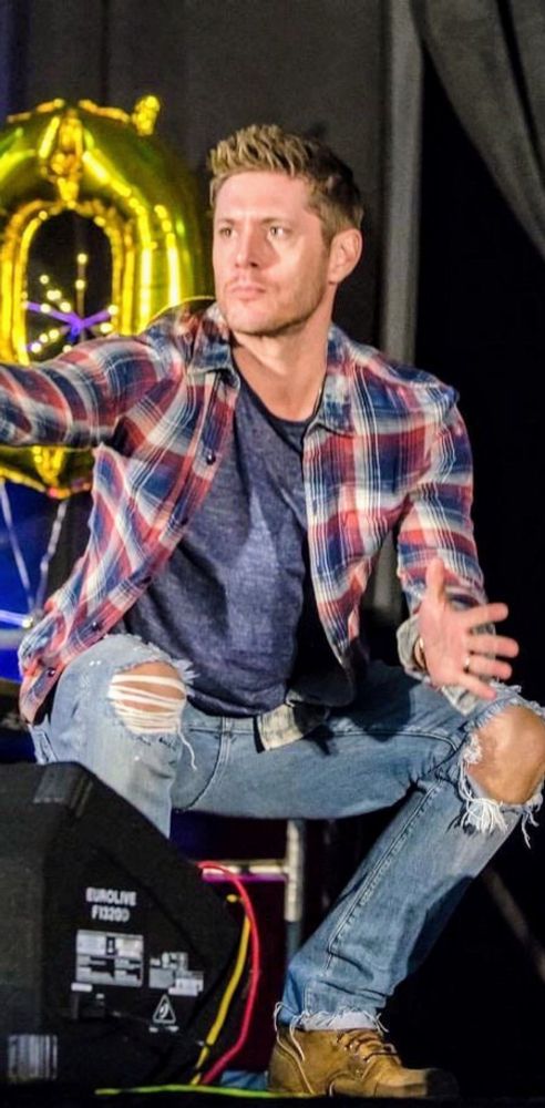 Jensen Ackles wearing old jeans, boots, and a flannel 