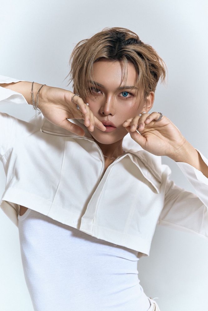 Hyun in all white showing off his itty bitty waist