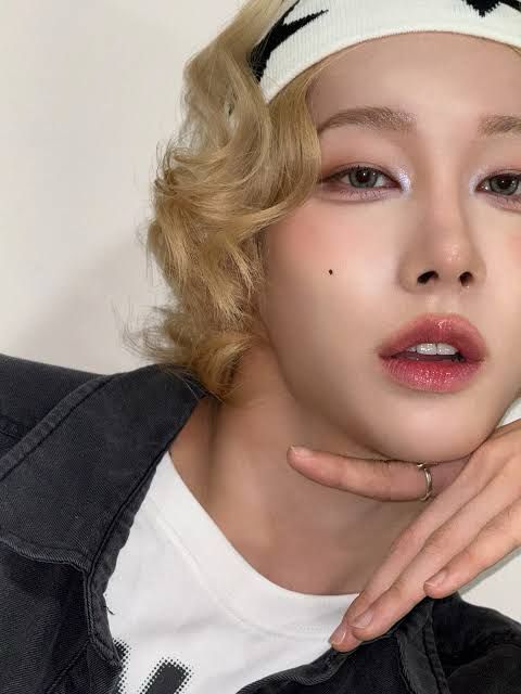 Rui with short curly blond hair