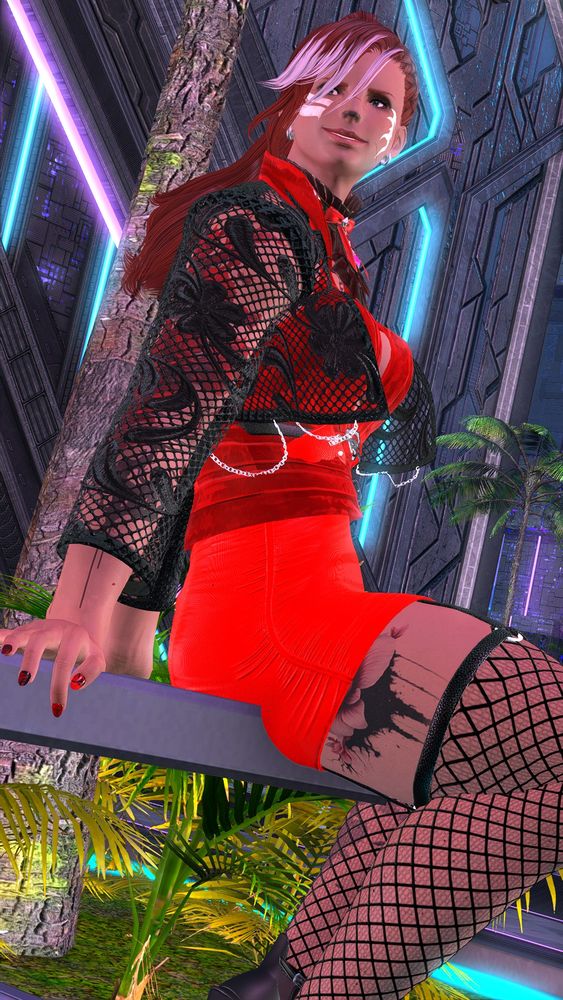 Ruby is sitting on a railing dressed in allouring red dress with fishnet top and fishnet stackings.