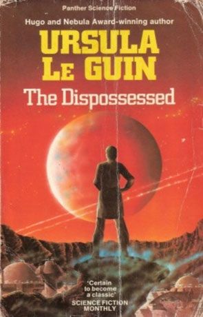 Cover of the Dispossessed by Ursula LeGuin. A silhouetted figure on rocky ground against a red sky 