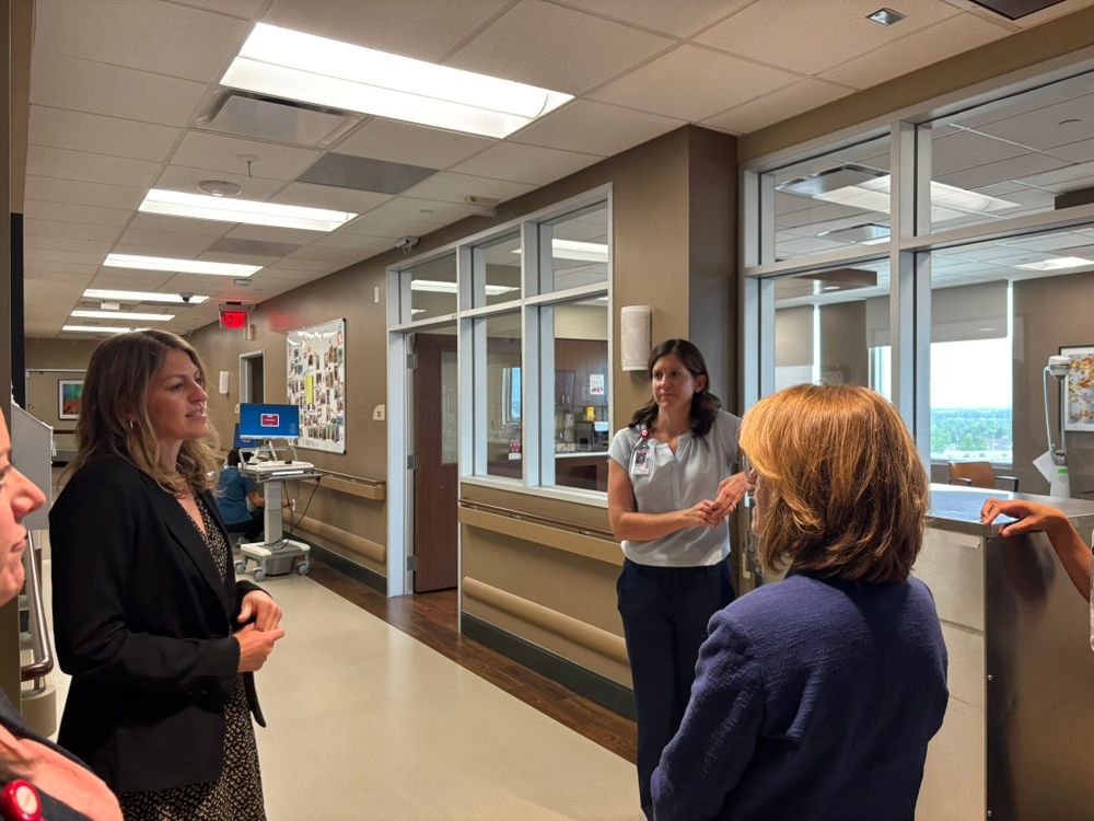 Shannon Bird visits with staff at UC Health Broomfield Hospital. 