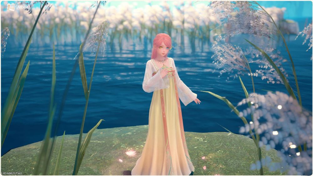 Infinity nikki screenshot of Nikki standing on a grassy patch of land. There is water and tall plants surrounding her. 