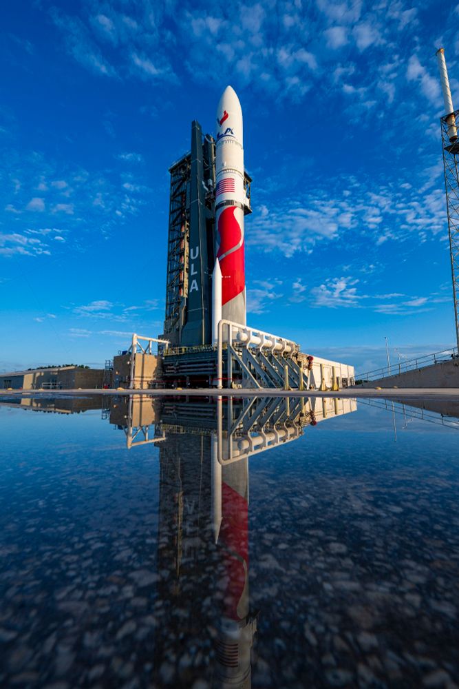 United Launch Alliance's Vulcan rocket reflected in mirror smooth water in the morning light. This is the ride that carries my project!