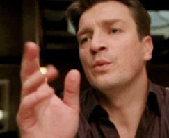 Nathan Fillion doing his "confused" meme.