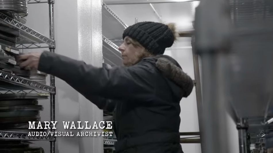 Archivist Mary Wallace in the Reuther Library's walk-in freezer storage.