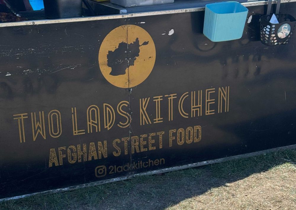 A restaurant sign saying "Two Lads Kitchen"