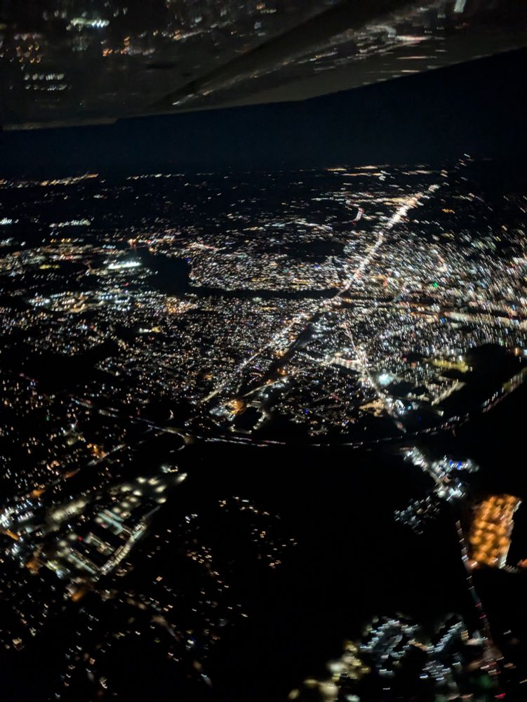 Nighttime shot of Lowell, MA from the air