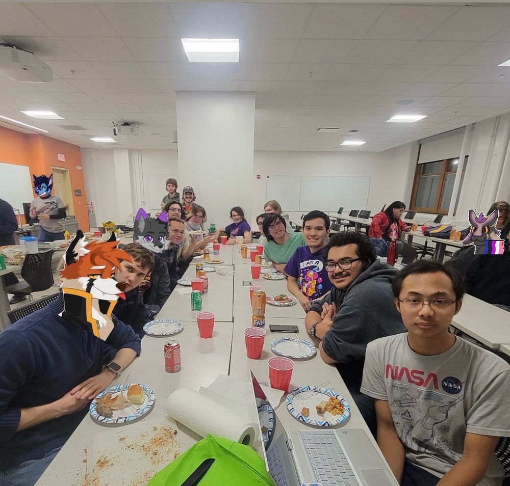 Indoor shot of Illinifurs eating a meal together