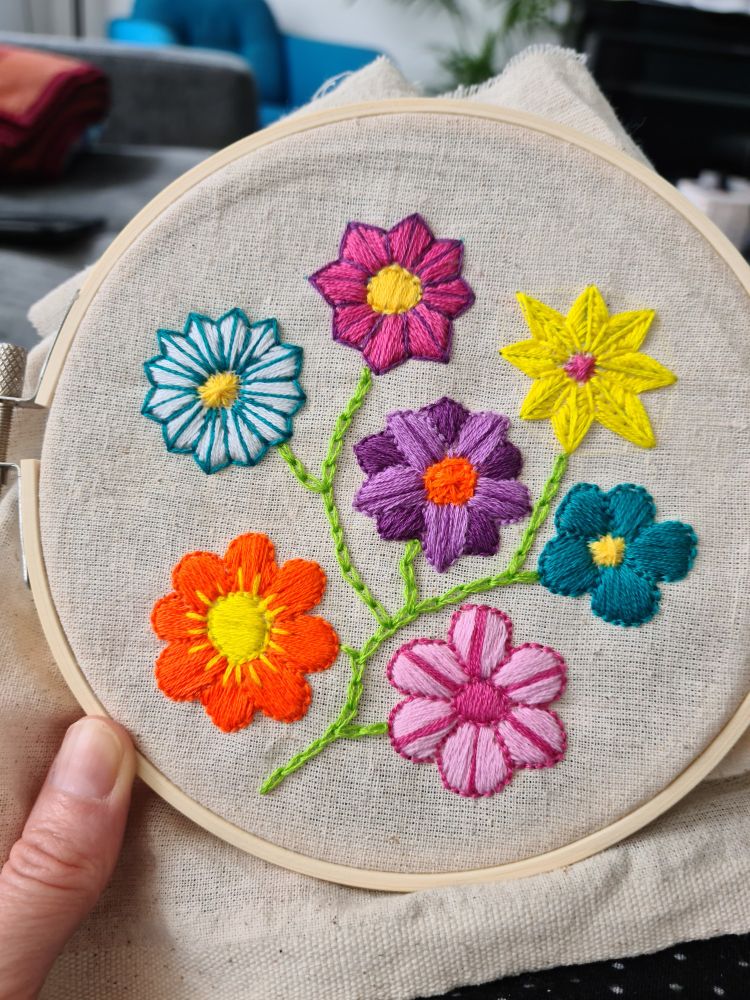 Multi-coloured embroidered flowers.