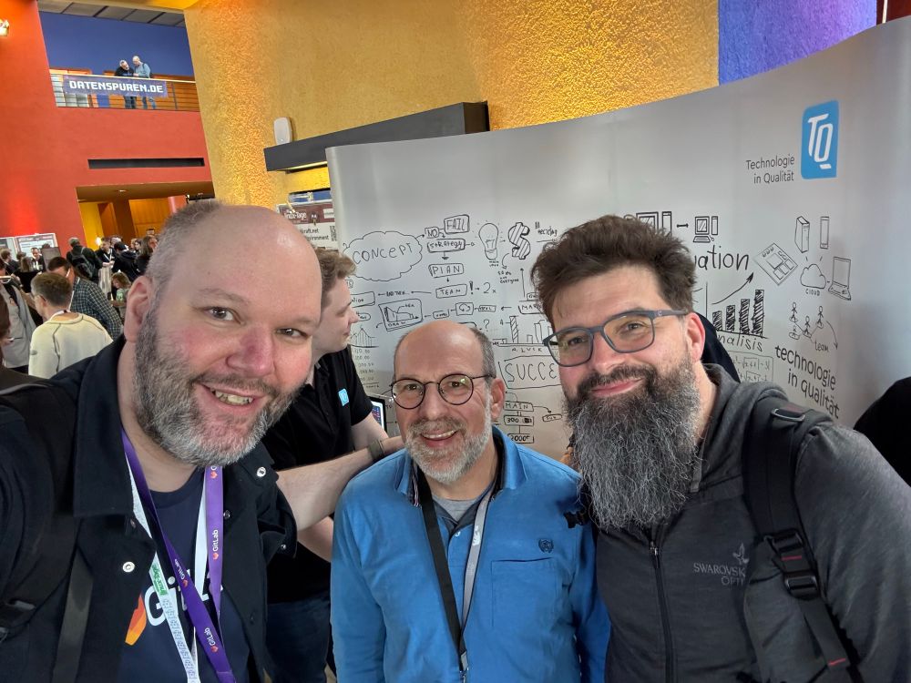 Michi, Markus, Markus in front of the TQ booth at Chemnitz Linux Days